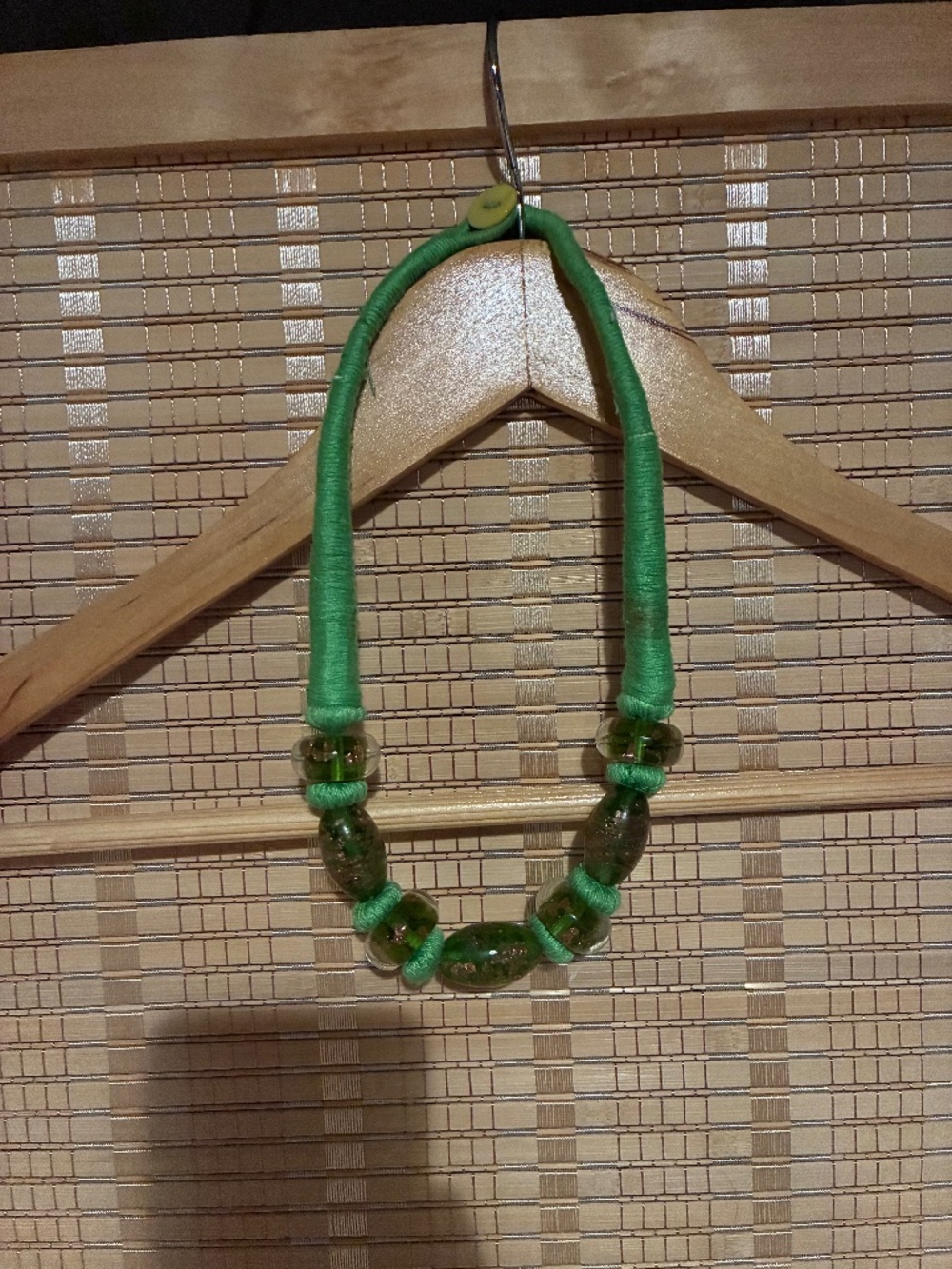 Green thread and glass bead necklace